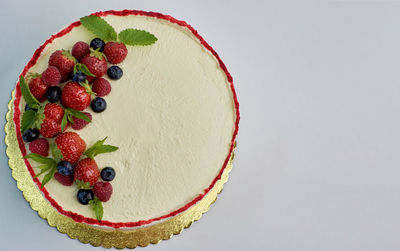 Close-up of cake against white background