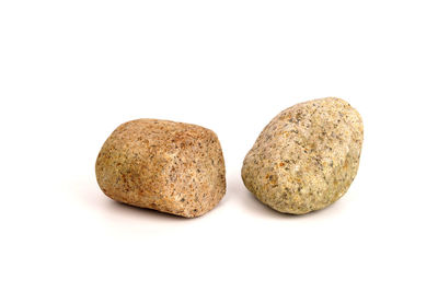 Close-up of bread against white background
