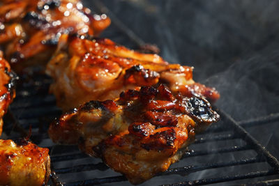 Close-up of meat on barbecue grill