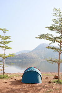 View of tent on mountain against clear sky