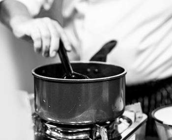 Close-up of hand holding tea cup