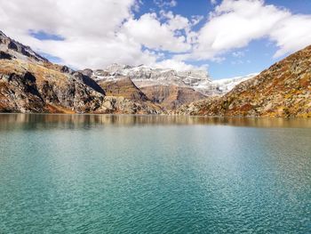 Scenic view of lake and mountains against sky