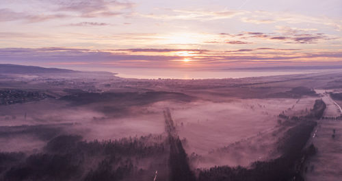 Scenic view of landscape against sky during sunset