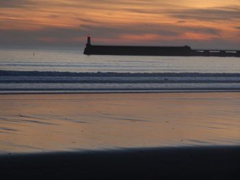 Scenic view of sea against sky during sunset