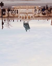 Reflection of building in puddle