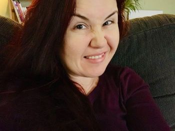 Portrait of smiling young woman at home