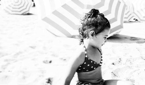 Girl sitting at beach