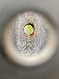 High angle view of hole in plate