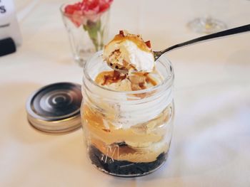 Close-up of ice cream in jar on table