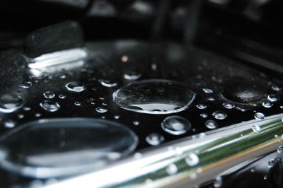 Close-up of water drops on motorcycle
