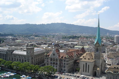 High angle view of buildings in city against sky