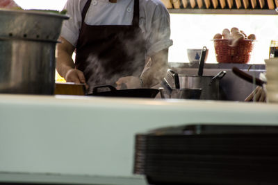 Close-up of man working in restaurant