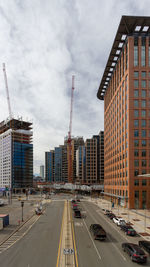 City street and buildings against sky