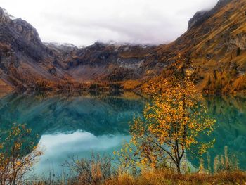 Scenic view of lake against sky during autumn