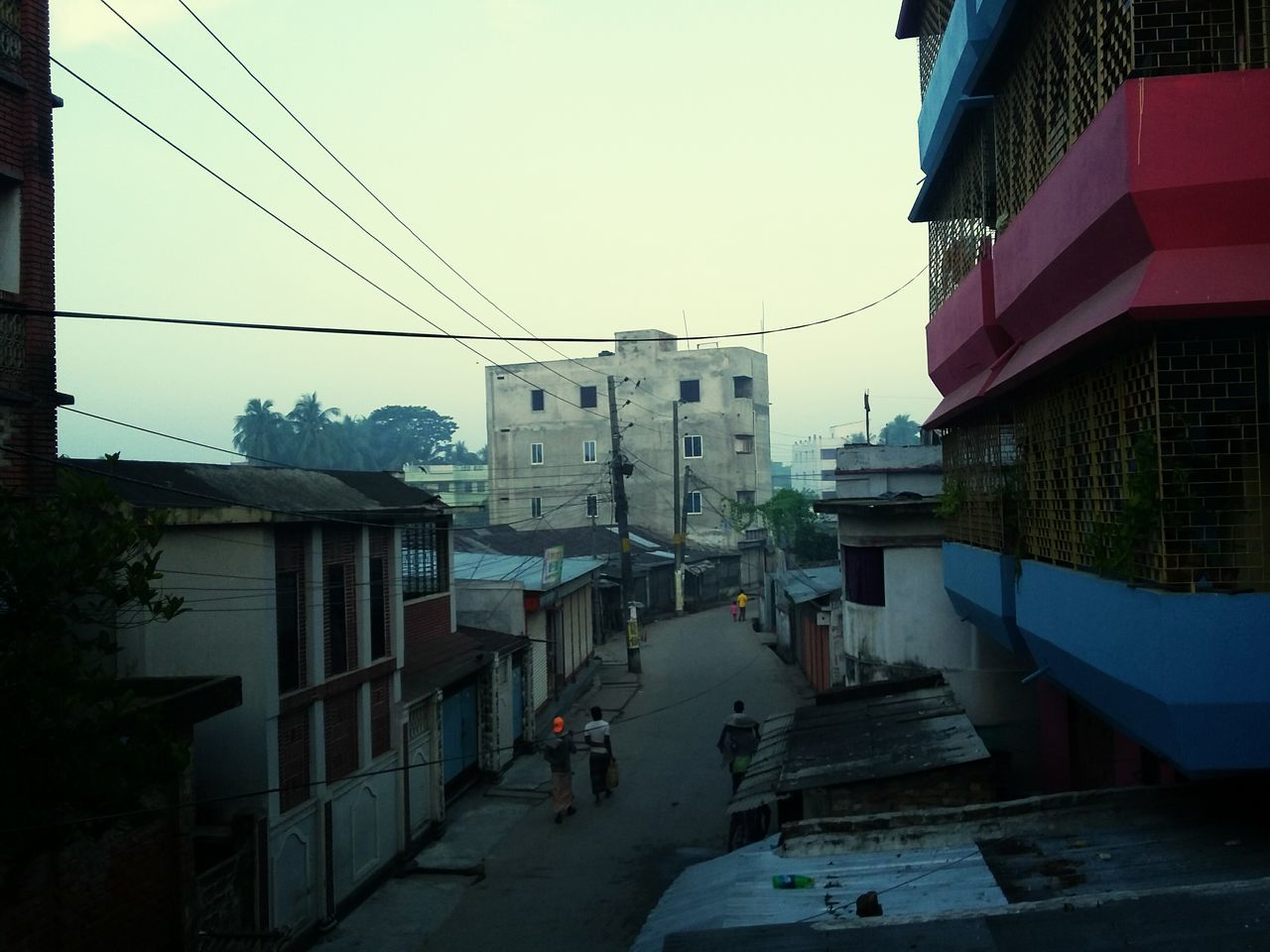 building exterior, architecture, built structure, residential structure, residential building, clear sky, city, house, building, residential district, street, sky, power line, outdoors, day, copy space, town, city life, cable, no people