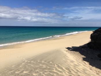 Scenic view of beach against sky