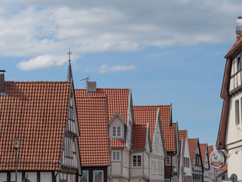 Low angle view of buildings in city against sky