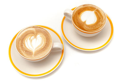 Close-up of coffee cup over white background
