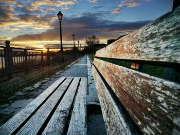 Railroad tracks against sky during sunset