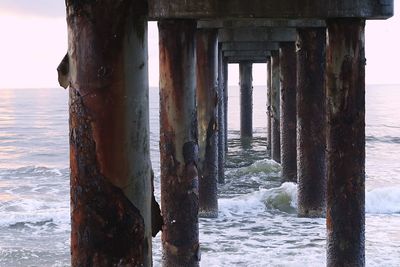Scenic view of sea against sky seen through pier