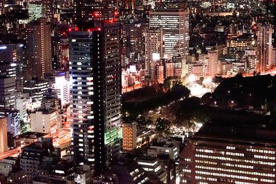 High angle view of city lit up at night