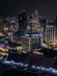 High angle view of illuminated buildings in city at night