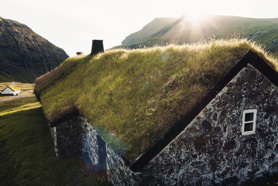 Scenic view of landscape against bright sun