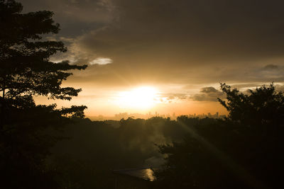 Scenic view of silhouette trees against sky during sunset