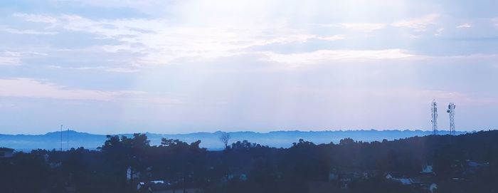Panoramic view of factory against sky