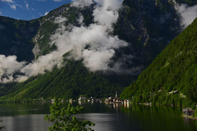 Scenic view of lake and mountains against sky