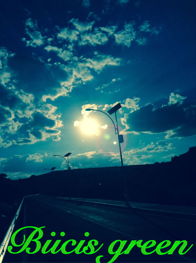 sky, street light, communication, cloud - sky, lighting equipment, road sign, low angle view, silhouette, cloud, cloudy, road, guidance, nature, dusk, outdoors, information sign, text, sunset, no people, tree