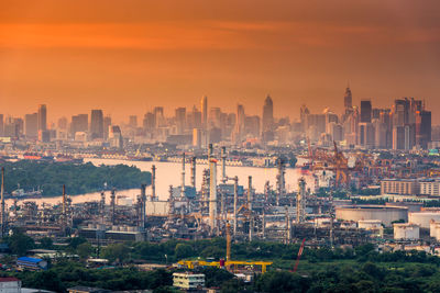 High angle view of buildings against sky during sunset