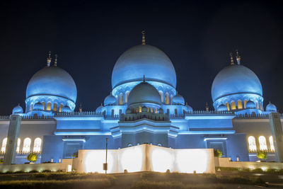 Low angle view of illuminated cathedral against sky