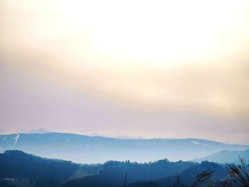 Scenic view of mountains against sky during sunset