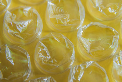 Macro photography of plastic air bubble film on a yellow background