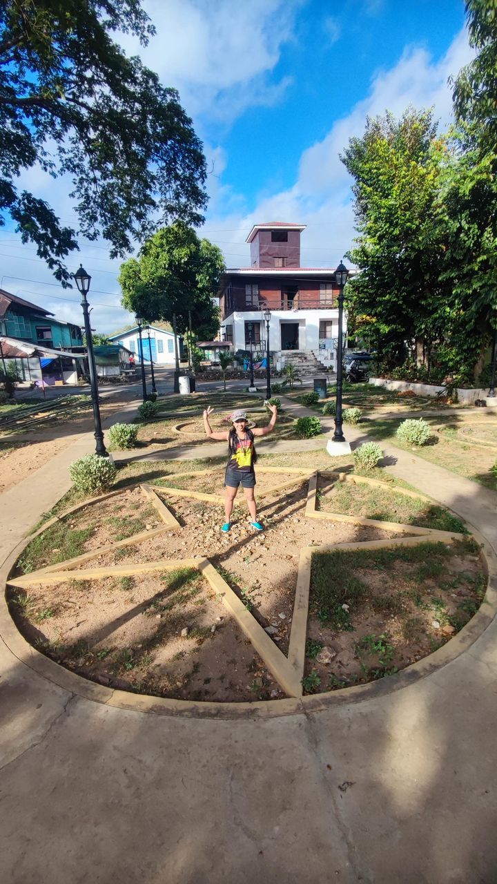 architecture, tree, built structure, building exterior, plant, sky, nature, men, full length, childhood, park, building, day, playground, child, one person, city, cloud, lifestyles, outdoors, house, adult, public space, residential area, neighbourhood, leisure activity, sports, estate