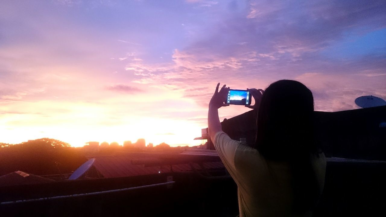 sunset, sky, cloud - sky, mode of transport, cloud, lifestyles, leisure activity, sun, nature, beauty in nature, unrecognizable person, orange color, scenics, outdoors, part of, landscape, journey, sunbeam, cloudy, tranquil scene