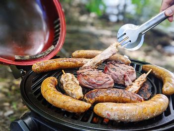 High angle view of meat on barbecue grill