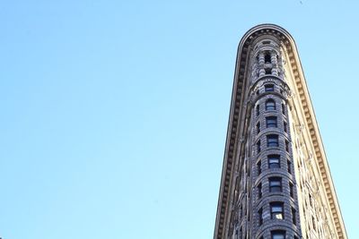 Low angle view of building against clear blue sky