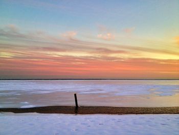 Scenic view of sea at sunset