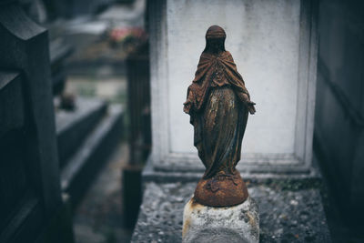 Close-up of statue against wall