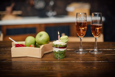 Fruits in glass on table