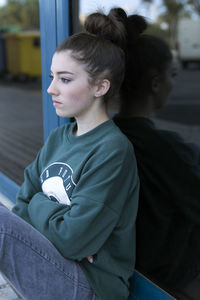 Thoughtful young woman looking away