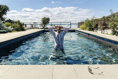 Man standing in swimming pool