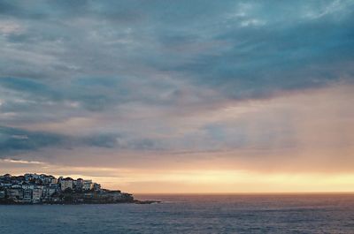 Scenic view of sea against dramatic sky