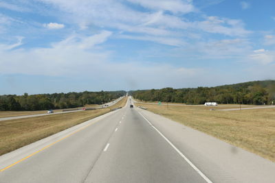 Empty road passing through landscape