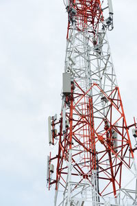 Low angle view of communications tower against sky