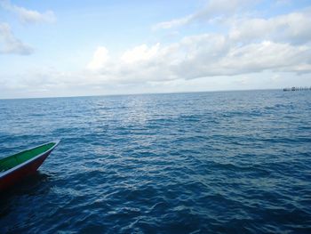 Scenic view of seascape against cloudy sky