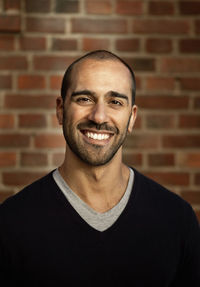 Close up portrait of cheerful mid adult man