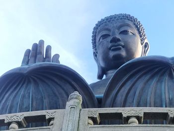 Low angle view of statue against sky